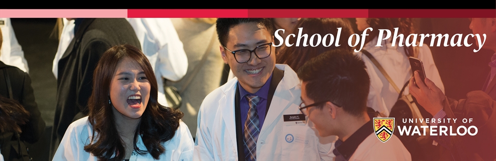 students in lab coats in the School of Pharmacy