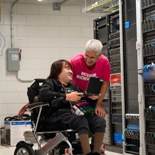 Dr. Martin Karsten and Peter Kai talking in a server room